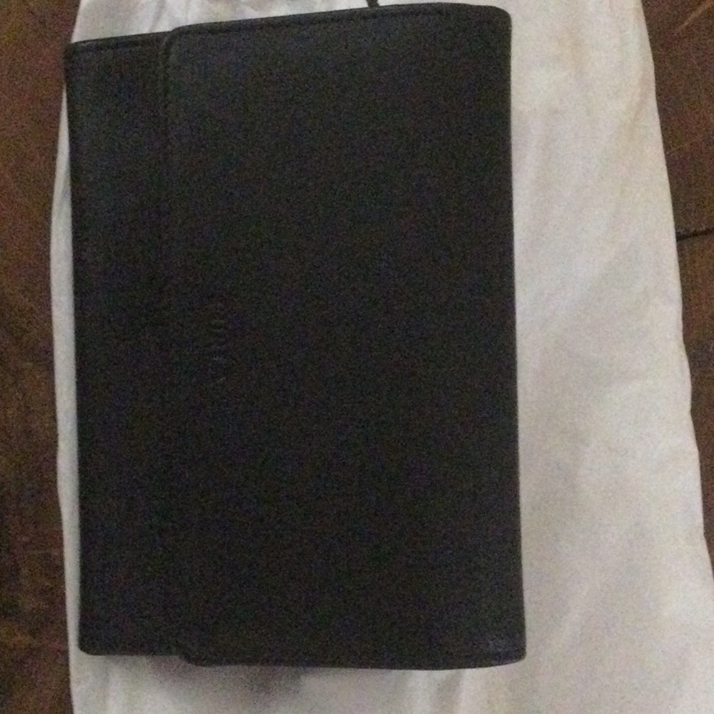 A midium size black wallet. Furla.  Made in Italy